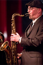 Professional saxophone player Kareem Kandi playing tenor sax in concert.