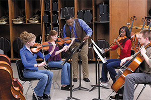 Students playing string instruments.