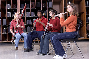 Students playing woodwind instruments.